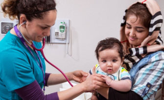 doctor with mother and baby